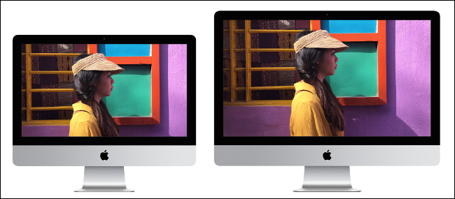 A 21-inch Apple iMac sitting next to a 27-inch Apple iMac.
