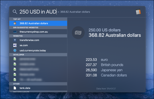 A macOS Spotlight Search for Currency Conversion.